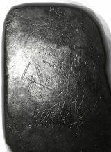 An inscribed slate bearing graffiti of a warrior on horseback Image of an inscribed slate bearing graffiti of a warrior on horseback